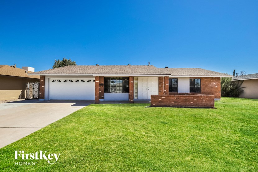 a house with a lawn in front of it