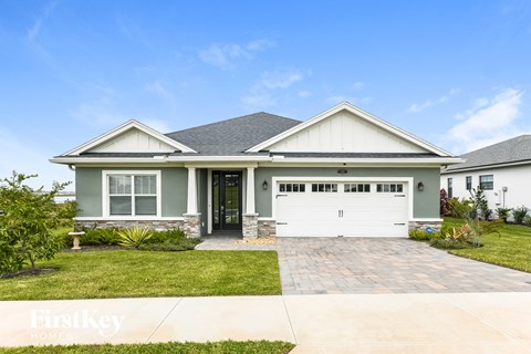 a blue and white house with a garage door