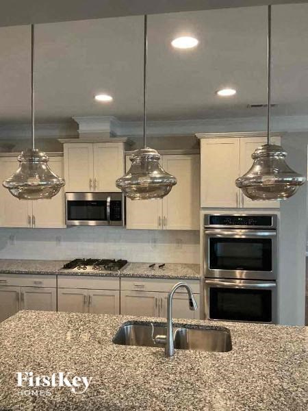 a kitchen with a granite counter top and a sink