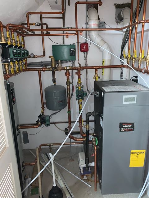 the heating system in the boiler room of a house