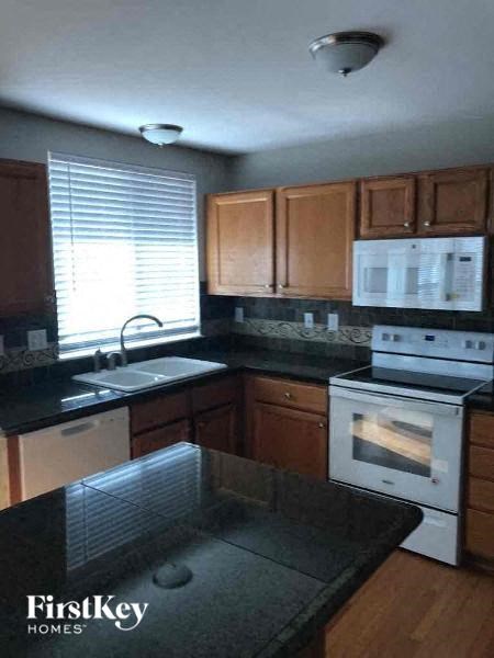 a kitchen with a stove and a sink