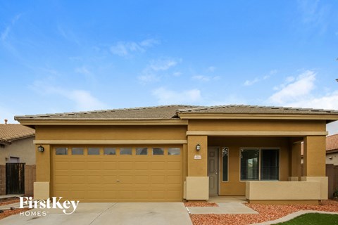 the front of a house with a garage door