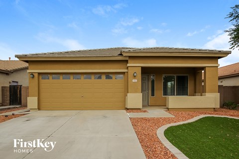 a house with a garage door and a driveway