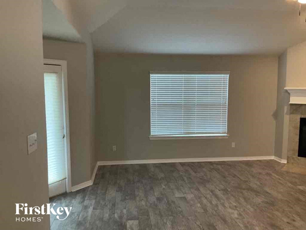 A room with a window and a door is shown.