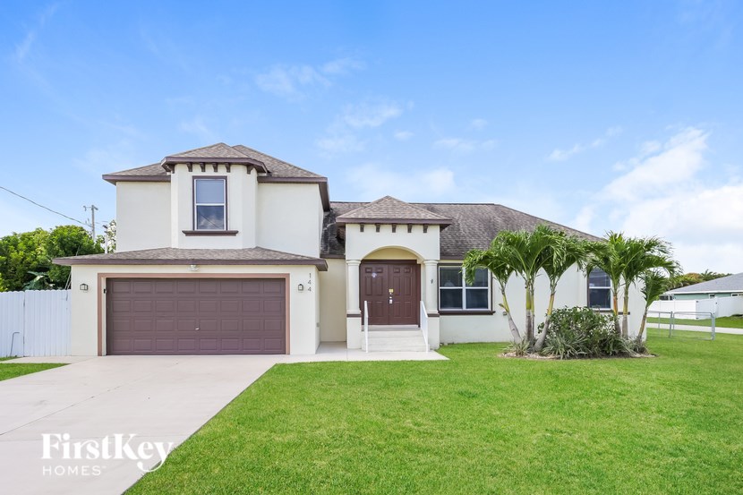 A house with a brown door and a brown garage door.