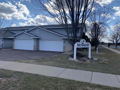 a house with a street sign in front of it