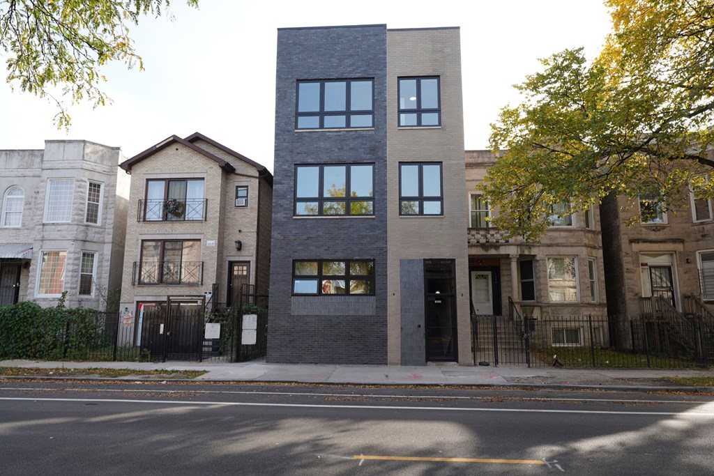 the exterior of the building is black and gray and there are