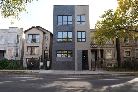 the exterior of the building is black and gray and there are