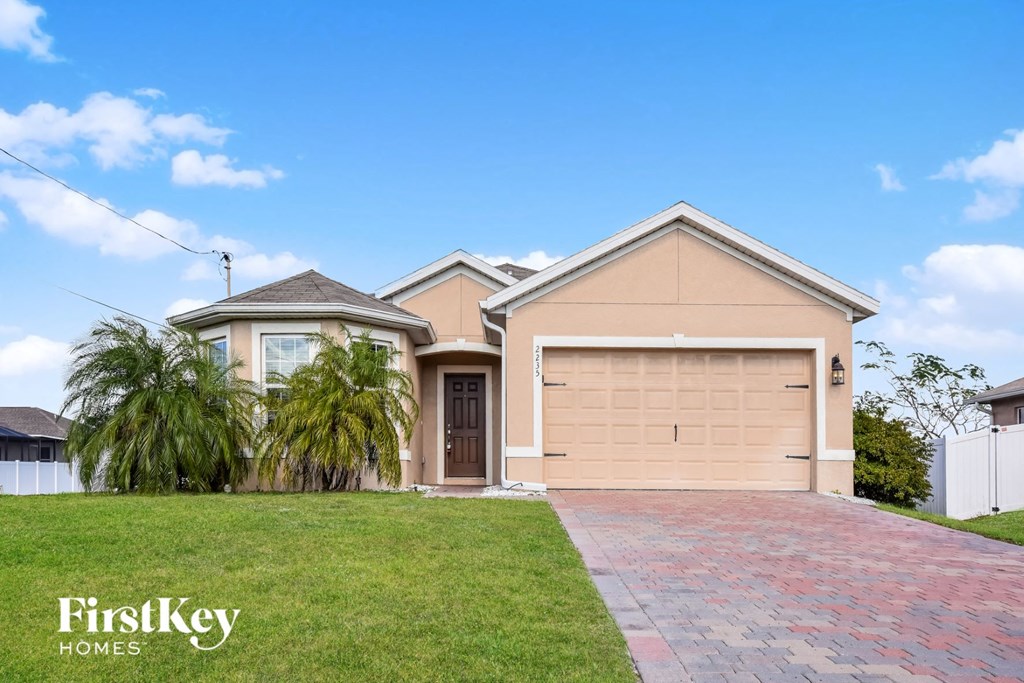 a house with a driveway and a garage door