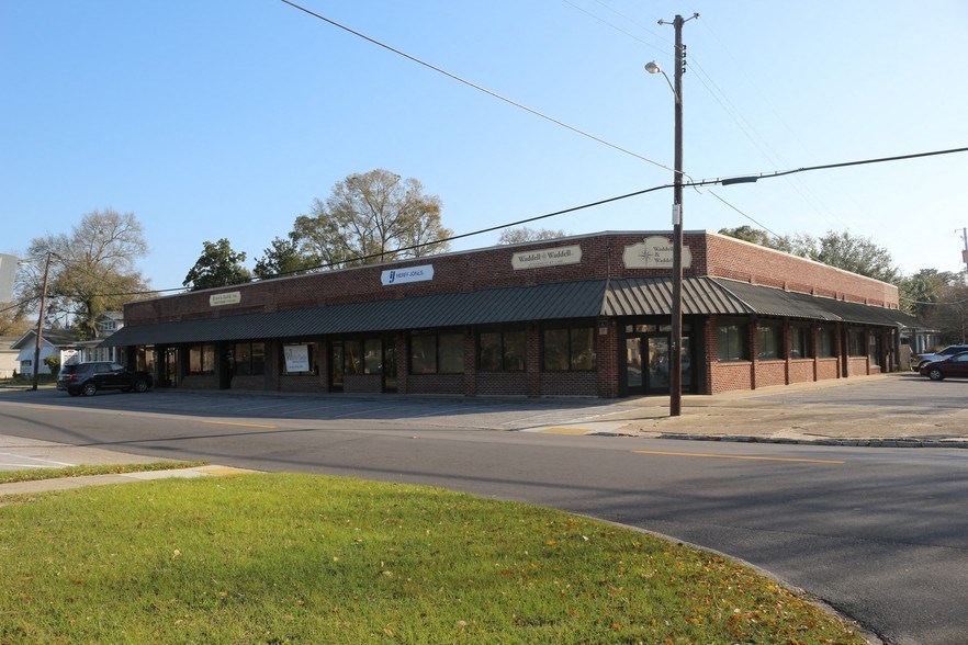 a building on the corner of a street