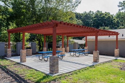 a picnic area with benches and a pavilion