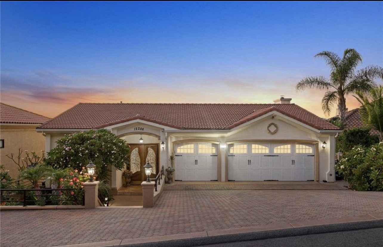 a house with a driveway and a garage door