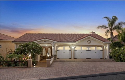 a house with a driveway and a garage door