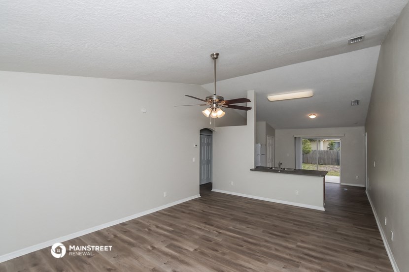 the spacious living room and kitchen of this manufactured home