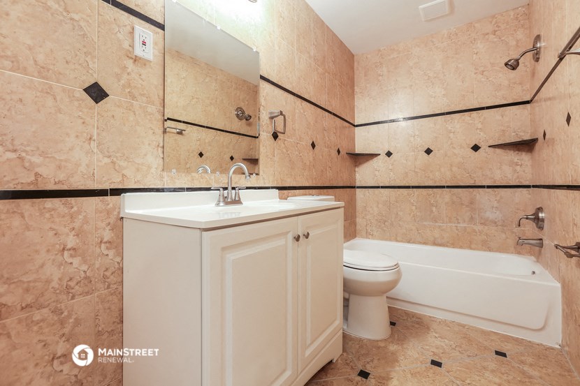 a bathroom with a sink toilet and a bath tub