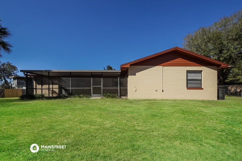a small house with a yard in front of it