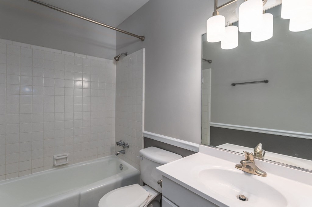 a bathroom with a sink toilet and a bath tub