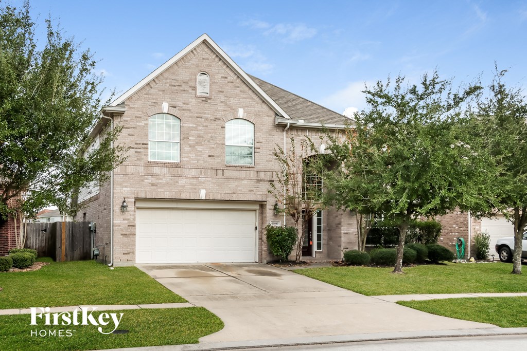 a brick house with a white garage door