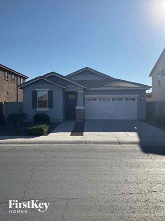 a house with a driveway and a white garage door