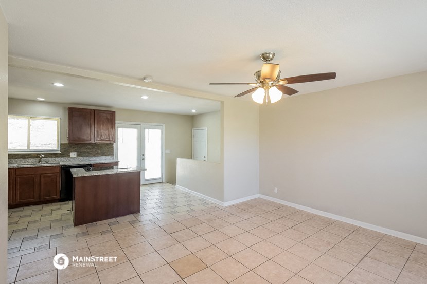 the kitchen is open to the dining room and living room