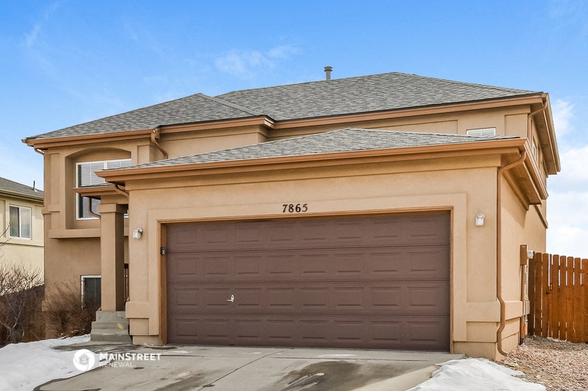 a garage door in front of a house