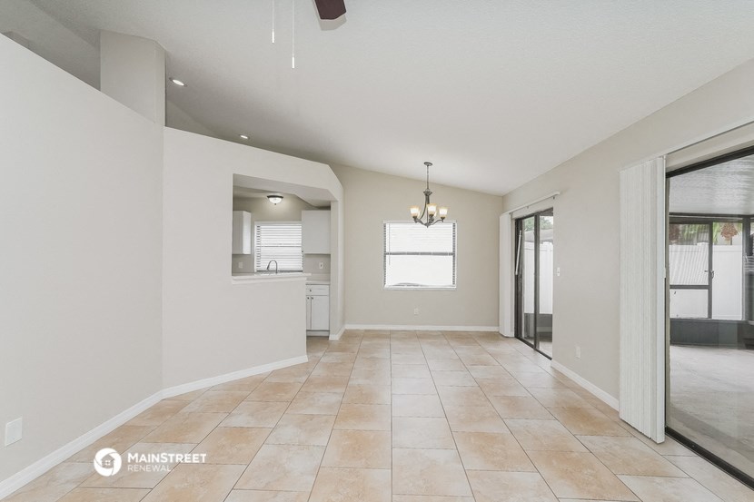 the spacious living room and dining room are open to the kitchen