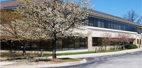 a building with a tree in front of it