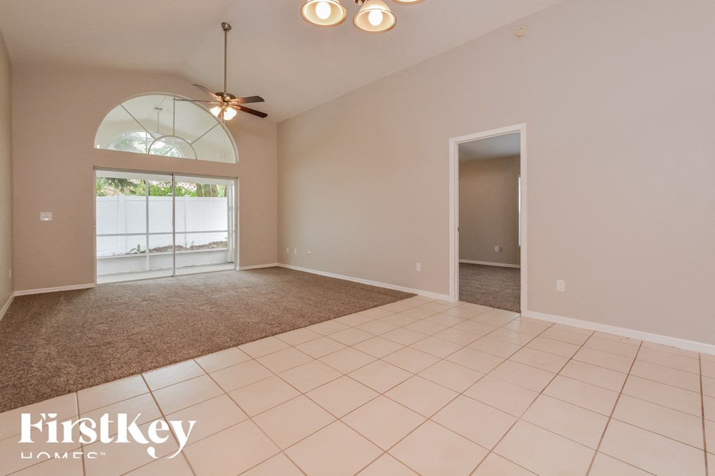 the living room and dining room are spacious and empty