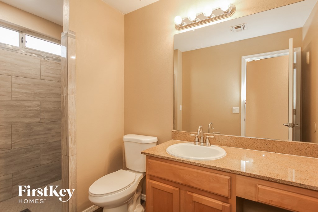 a bathroom with a sink toilet and a shower