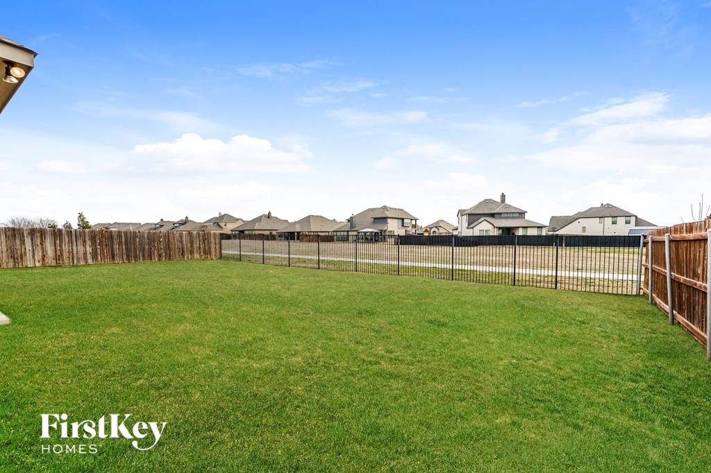 a fisheye view of a backyard with a fence