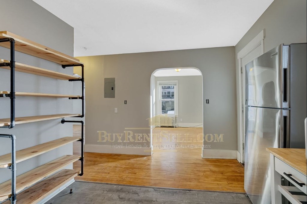 renovated apartment with a living room and a kitchen