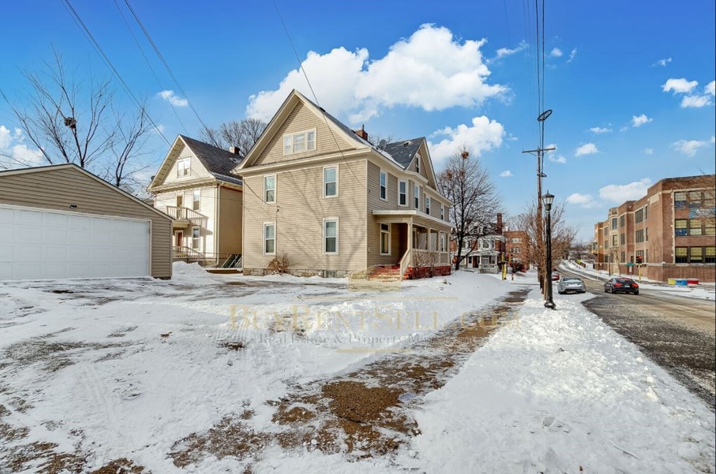 a group of houses on a snowy street