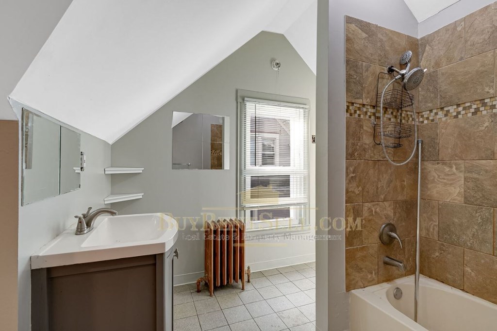 bathroom with shower and sink in a bedroom