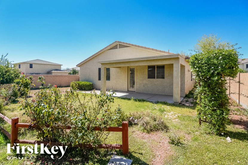 A house with a fence in front of it.