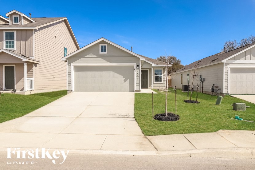 A residential area with houses and a clear sky.