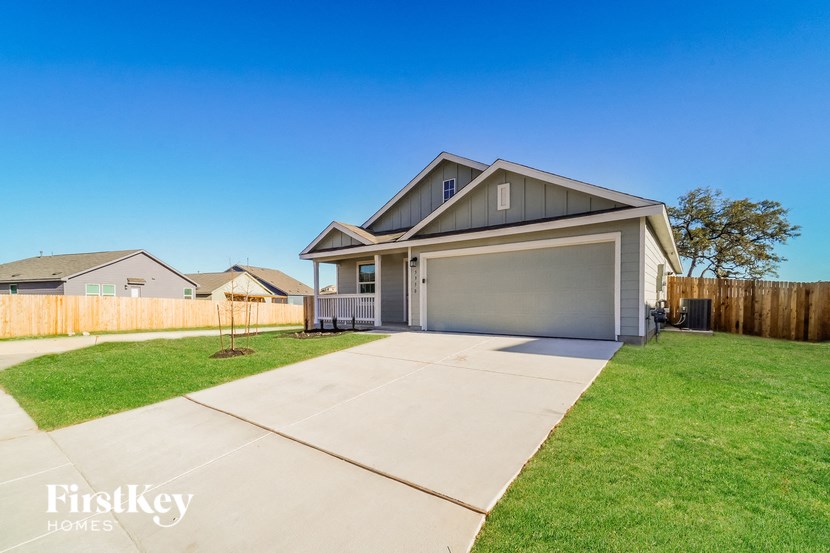 A house with a garage is for sale by FirstKey Homes.