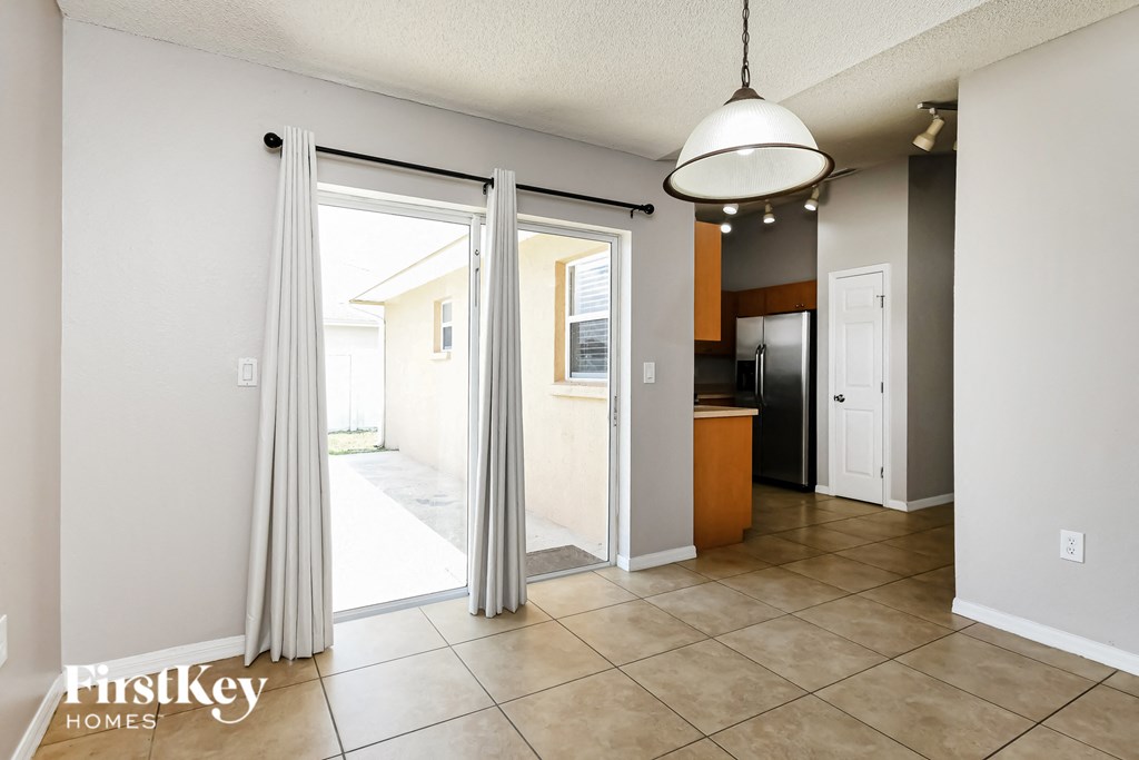a view of the living room and kitchen from the dining room