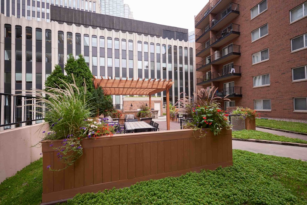 A wooden fence with planters on it.