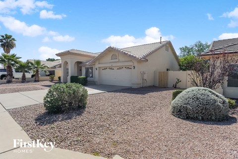 a home with a driveway and a garage door