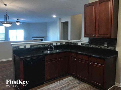 a kitchen with a counter top and a sink