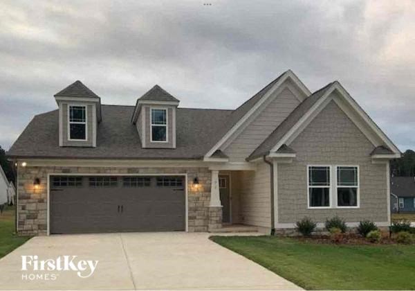a house with a driveway and a garage door