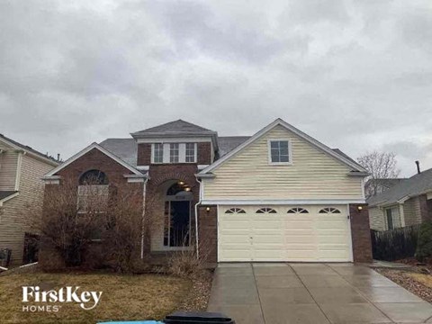a house with a white garage door