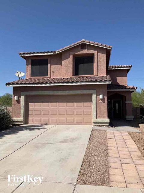 a house with a driveway and a garage door