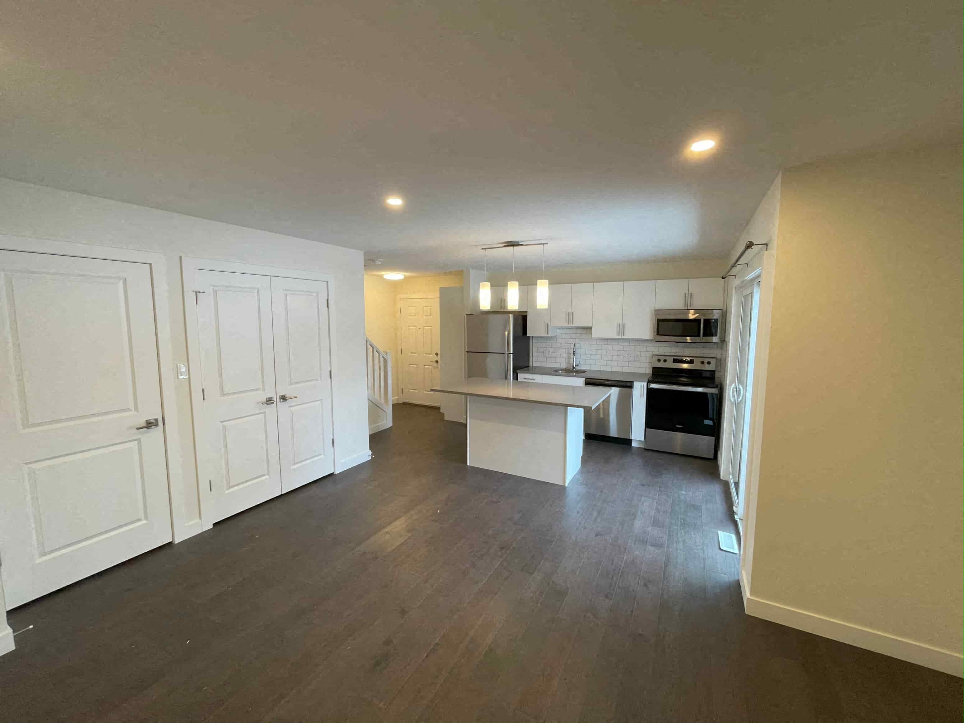 a view of the kitchen and dining room from the living room