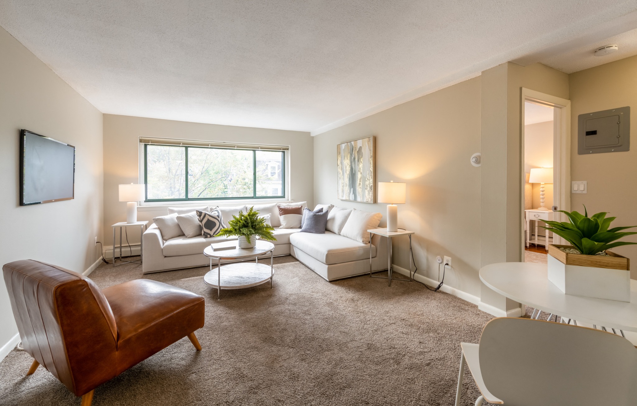 a living room with couches and a table