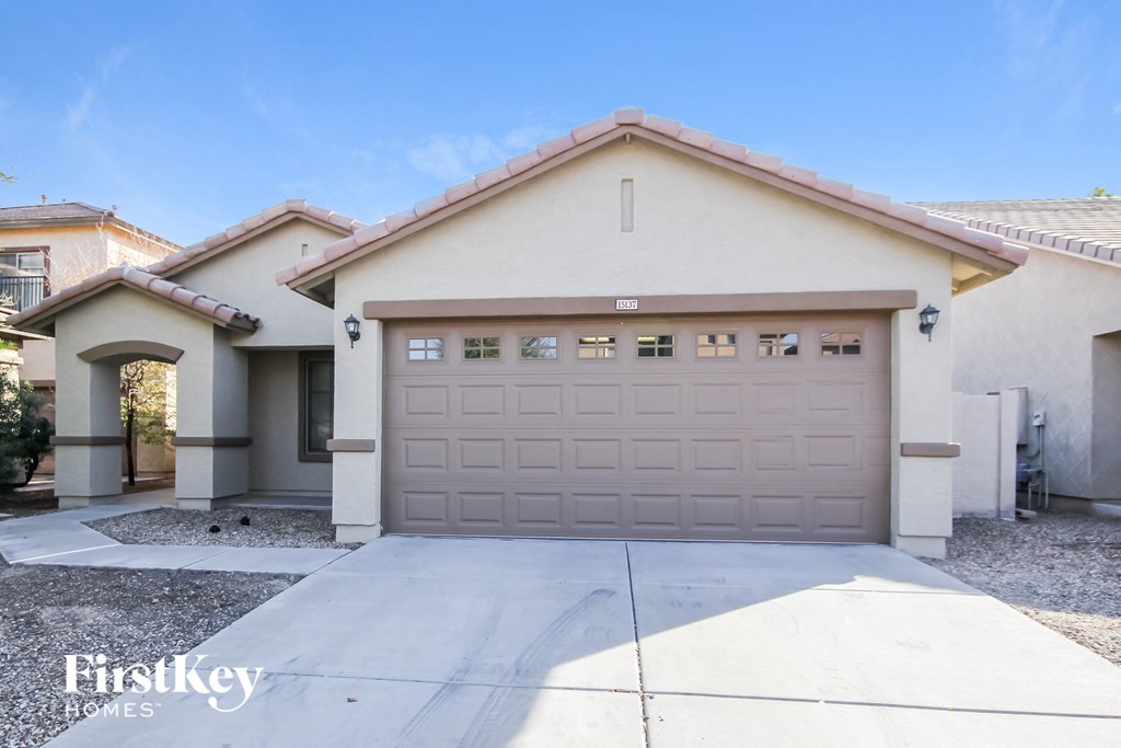 A house with a garage door that says "FirstKey Homes".