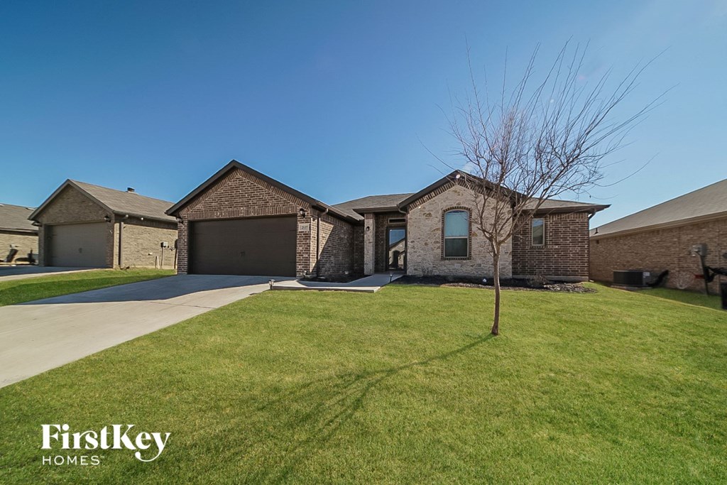 a house with a lawn in front of it