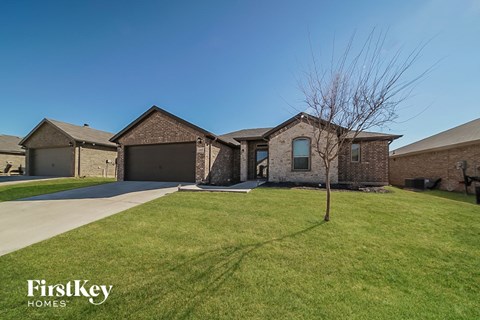 a house with a lawn in front of it