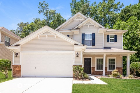 a suburban house with a white garage door