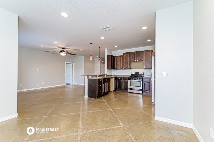 the kitchen is open to the living room and dining room